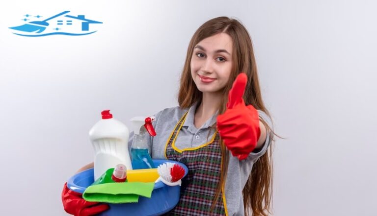 Female with cleaning equipment doing thumbs up.